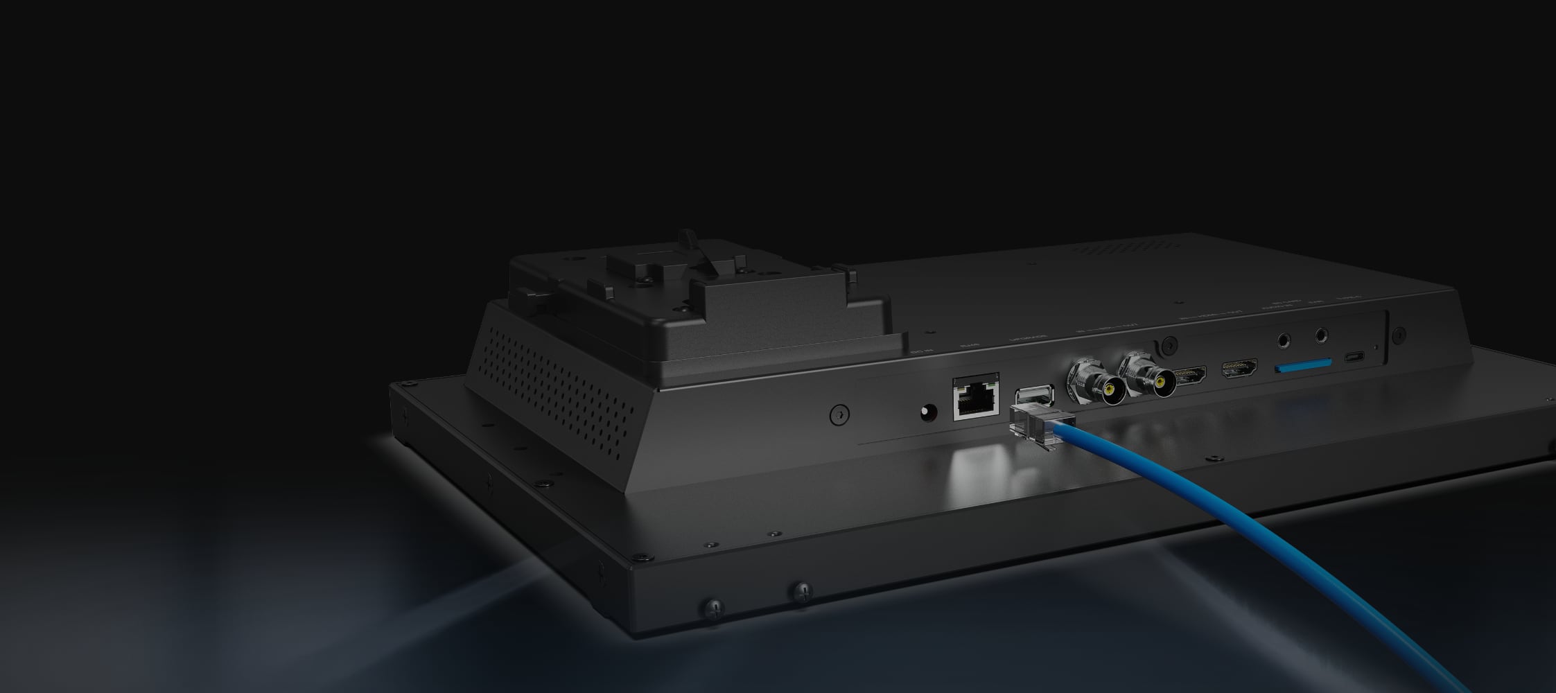 PVM160S-E rear panel with a LAN cable connected, V-lock battery mount and HDMI, 3G-SDI and SD card ports